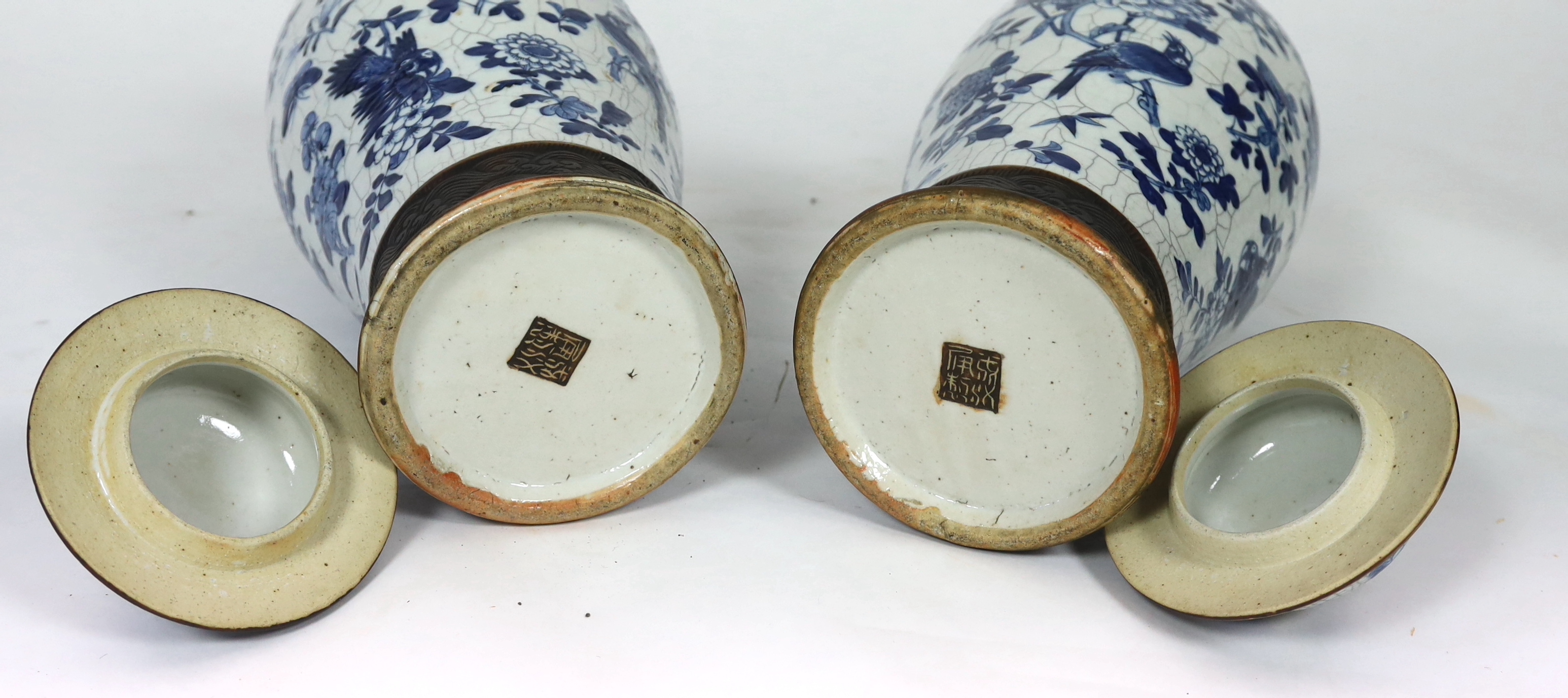 A pair of large Chinese blue and white crackle glaze vases and covers, late 19th century